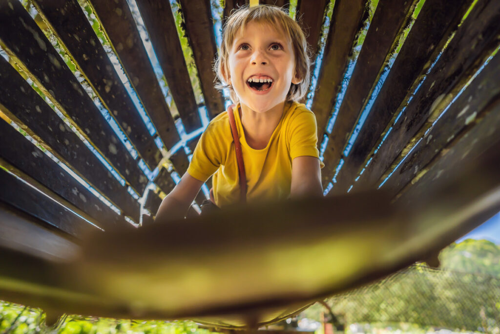 Navigating challenging adventure park courses can help build emotional resilience.