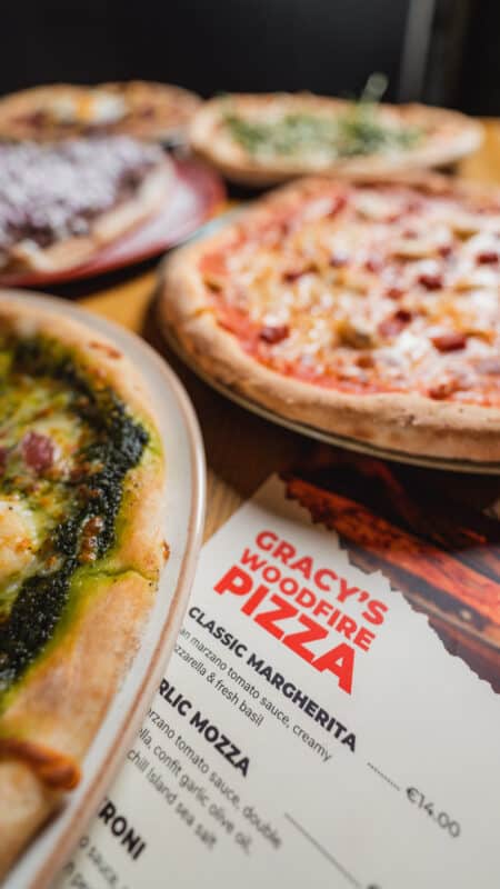 Try one of our famous woodfire pizzas at Gracy's at our BBQ & Beats Summer Series.